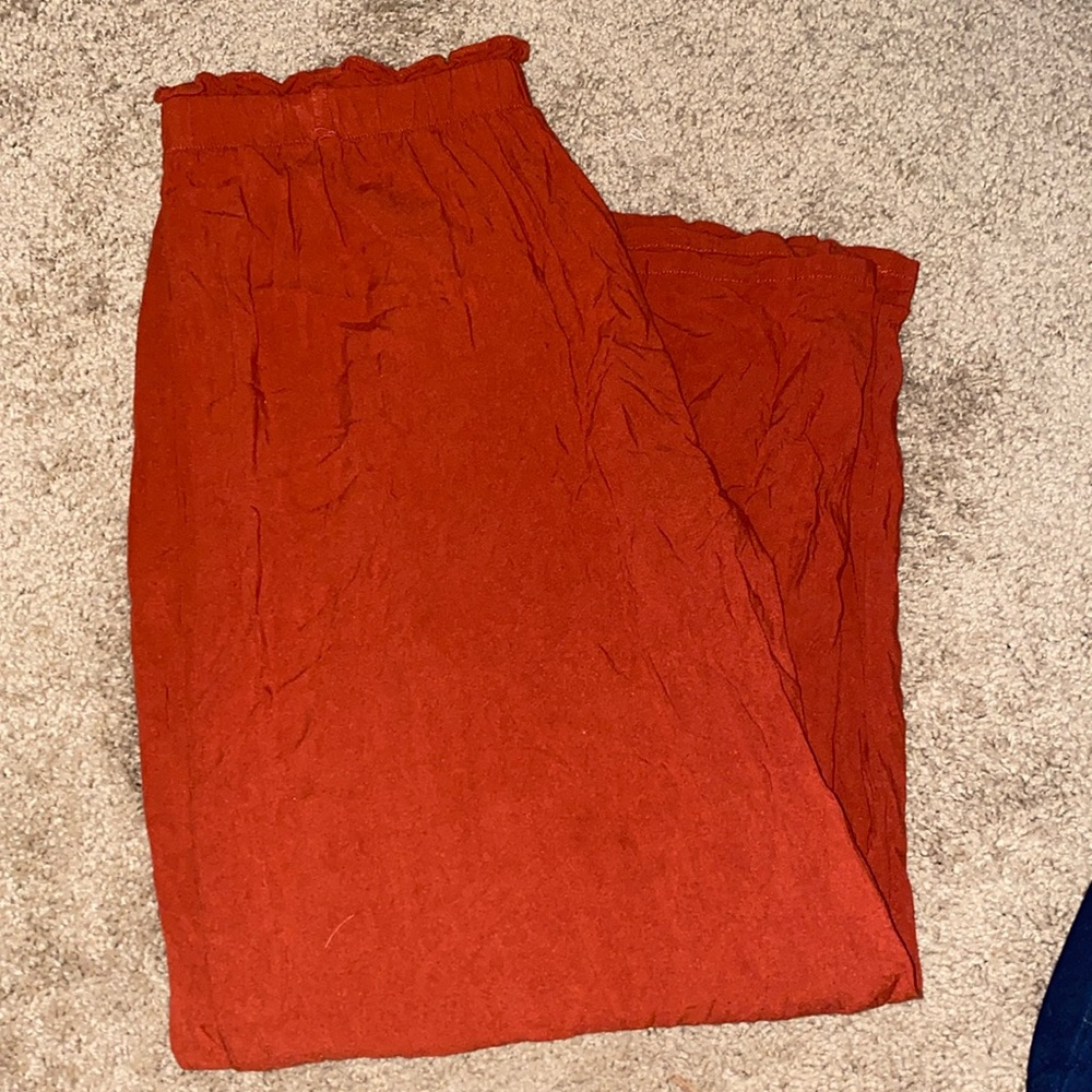 Live to be spoiled, burnt orange pants.